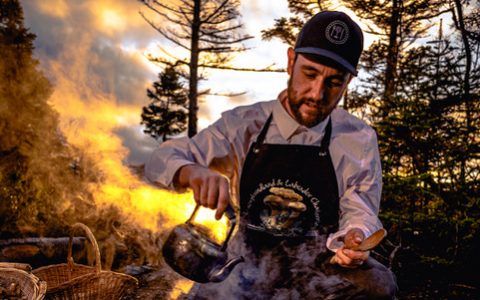 Photo of forager and author, Shawn Dawson, at a boil up in the woods.