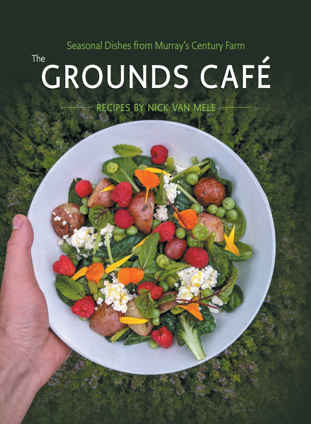 Front cover of The Grounds Cafe: Seasonal Dishes from Murray's Century Farm with recipes by Nick van Mele. Leafy green background with a hand holding a bowl of colourful salad in the fore.